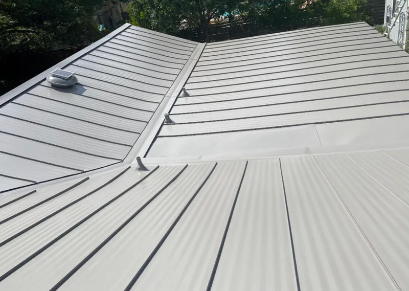 Solar attic fan installed on a metal roof for Roof Ventilation in Garden Acres